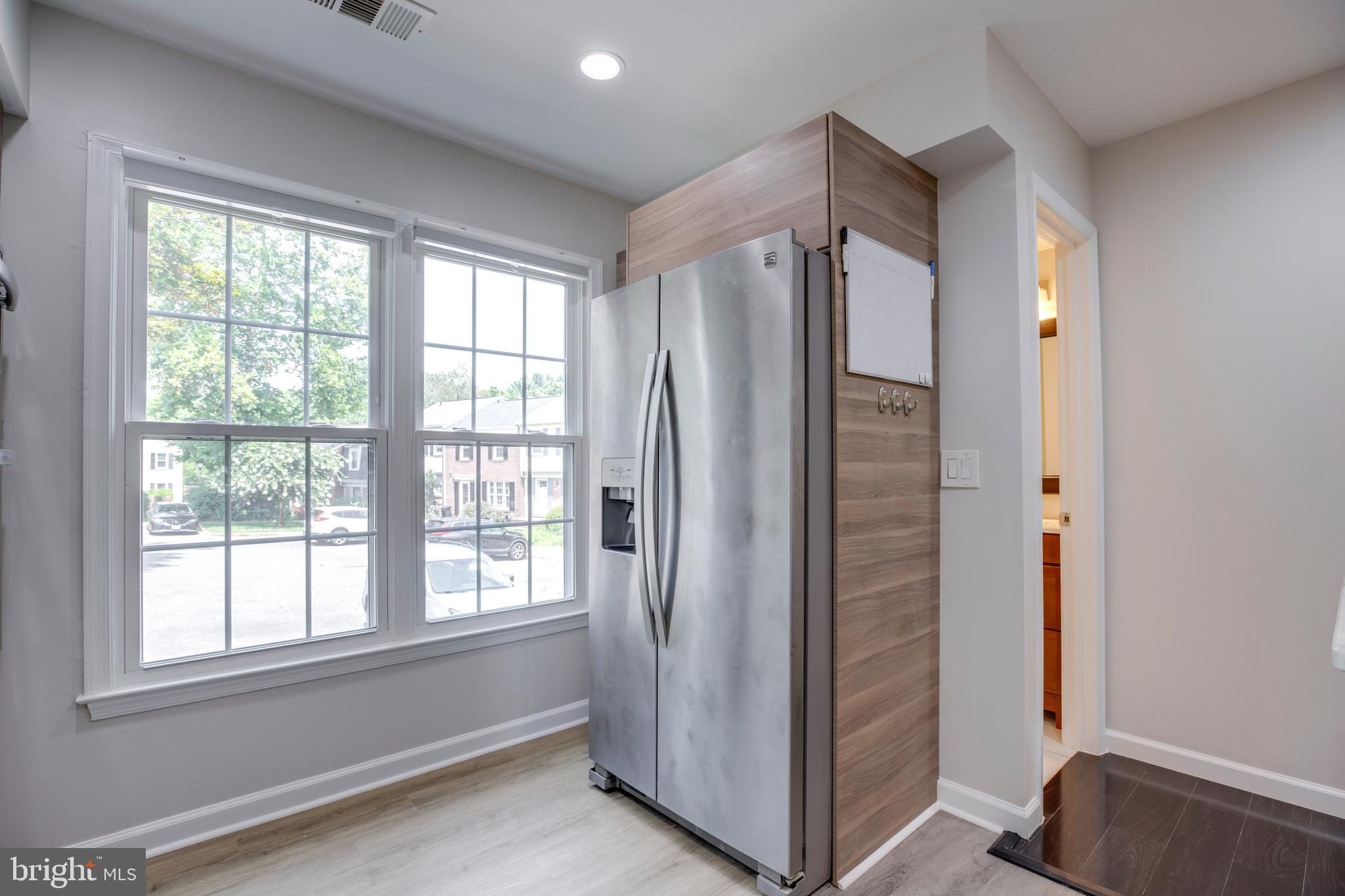 9513 Burdett Road Burke, VA 22015 - Photo 12 of 40 a view of an empty room with a window