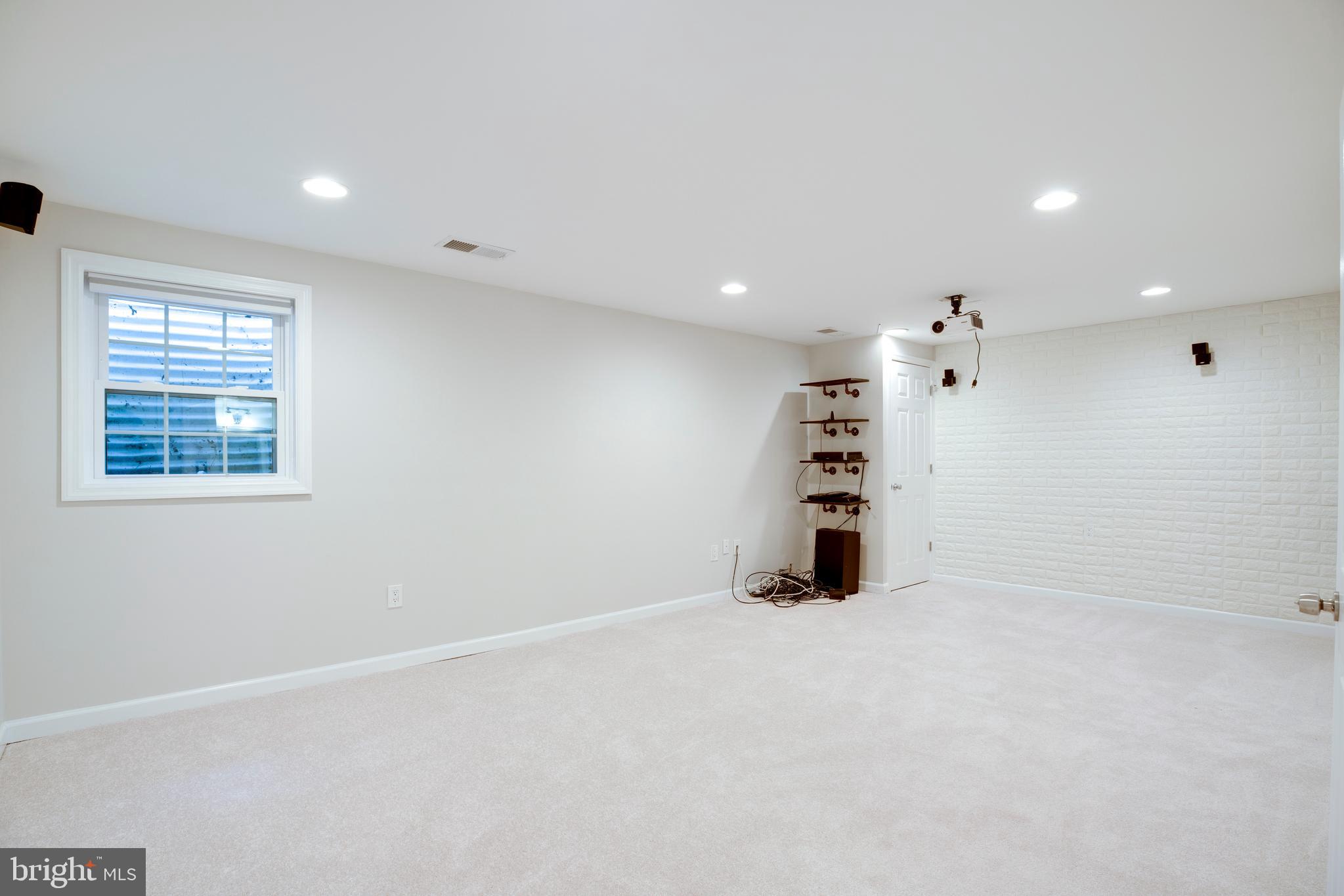 9513 Burdett Road Burke, VA 22015 - Photo 26 of 40 an empty room with windows and closet