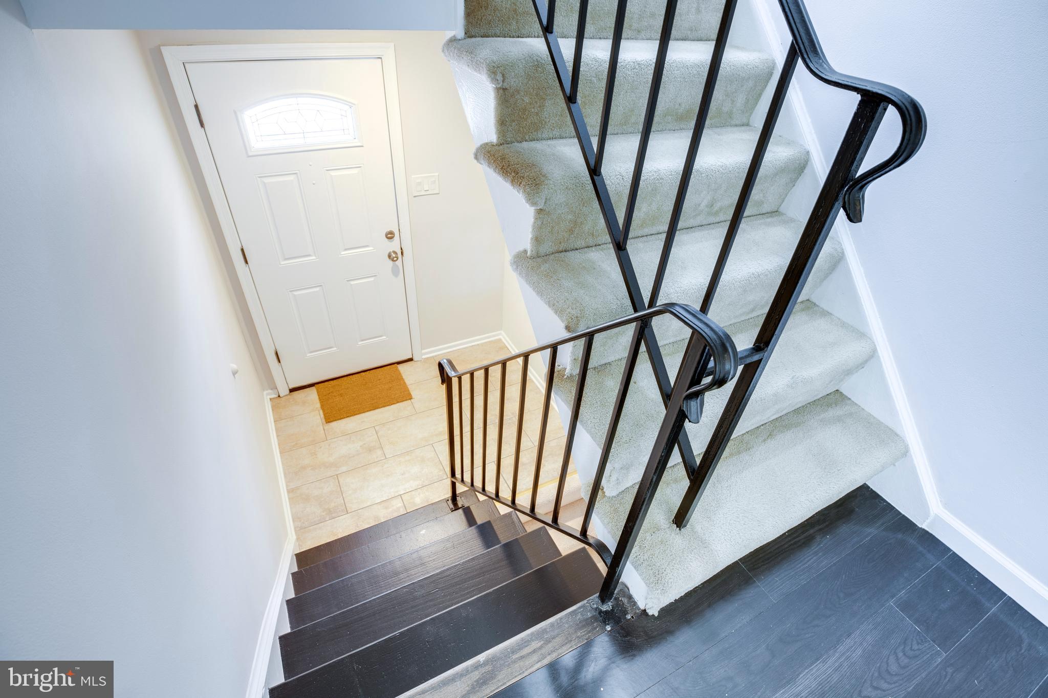 9513 Burdett Road Burke, VA 22015 - Photo 32 of 40 a view of an entryway with wooden floor