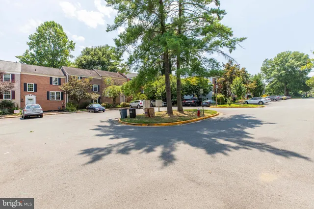 a childrens park with lots of swings slides and swimming pool