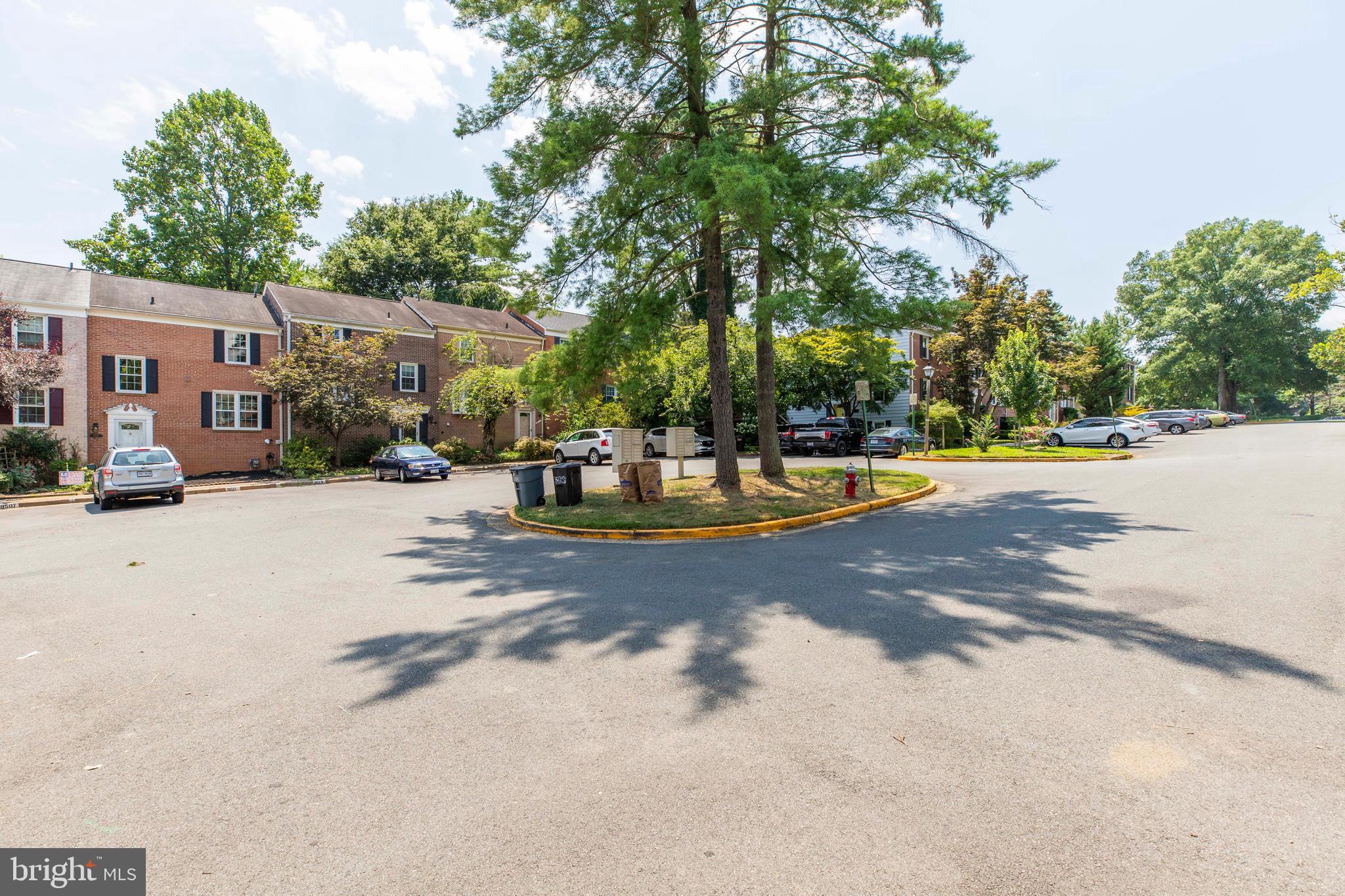 9513 Burdett Road Burke, VA 22015 - Photo 36 of 40 a view of a street with houses on both side