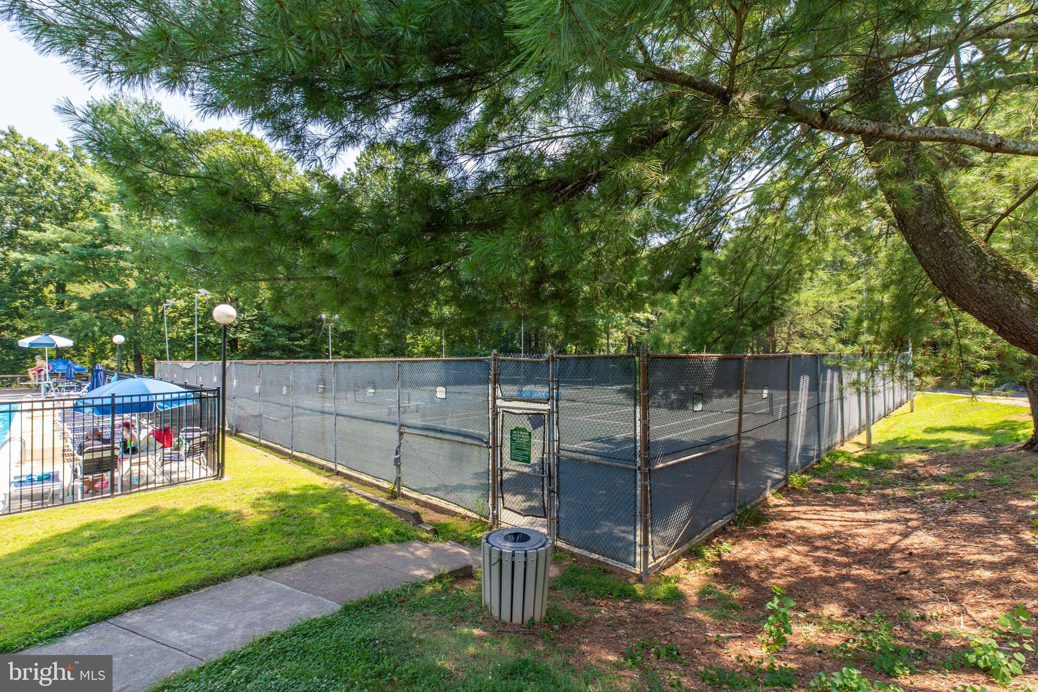 9513 Burdett Road Burke, VA 22015 - Photo 39 of 40 a view of a backyard with wooden fence