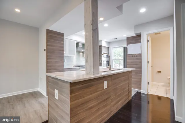 a bathroom with a sink and a large mirror