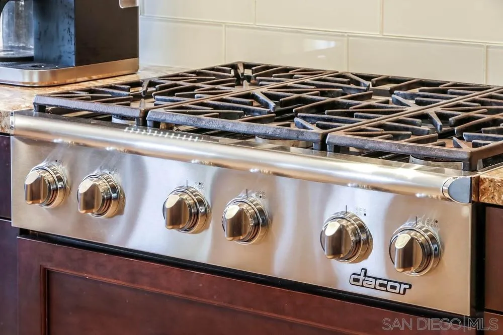 3396 Monique Lane Spring Valley, CA 91977 - Photo 21 of 51 a close up of a stove top oven sitting on a kitchen counter