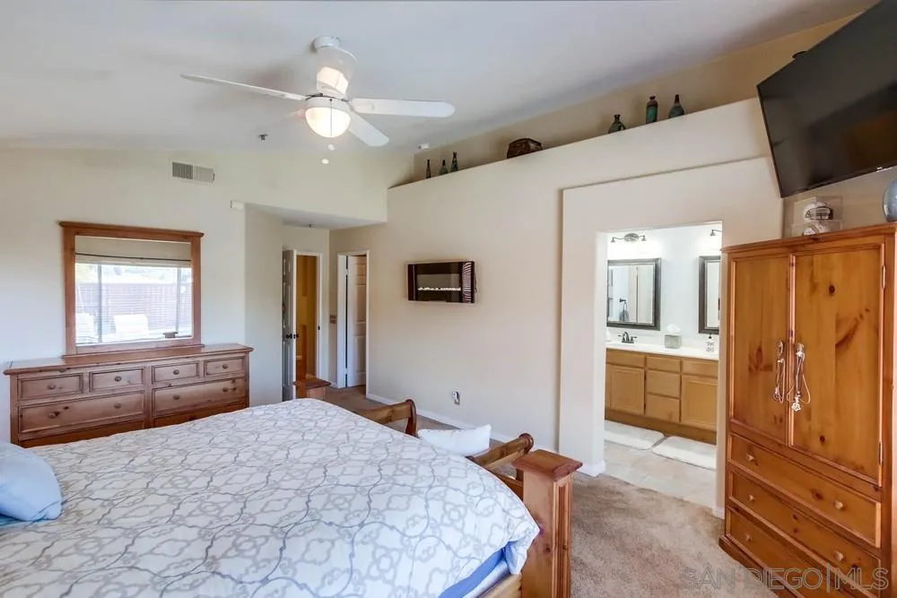 3396 Monique Lane Spring Valley, CA 91977 - Photo 27 of 51 a bedroom with a bed and flat screen tv