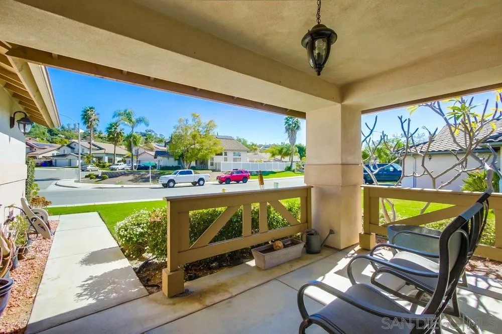 3396 Monique Lane Spring Valley, CA 91977 - Photo 3 of 51 a living room with furniture a rug and a floor to ceiling window