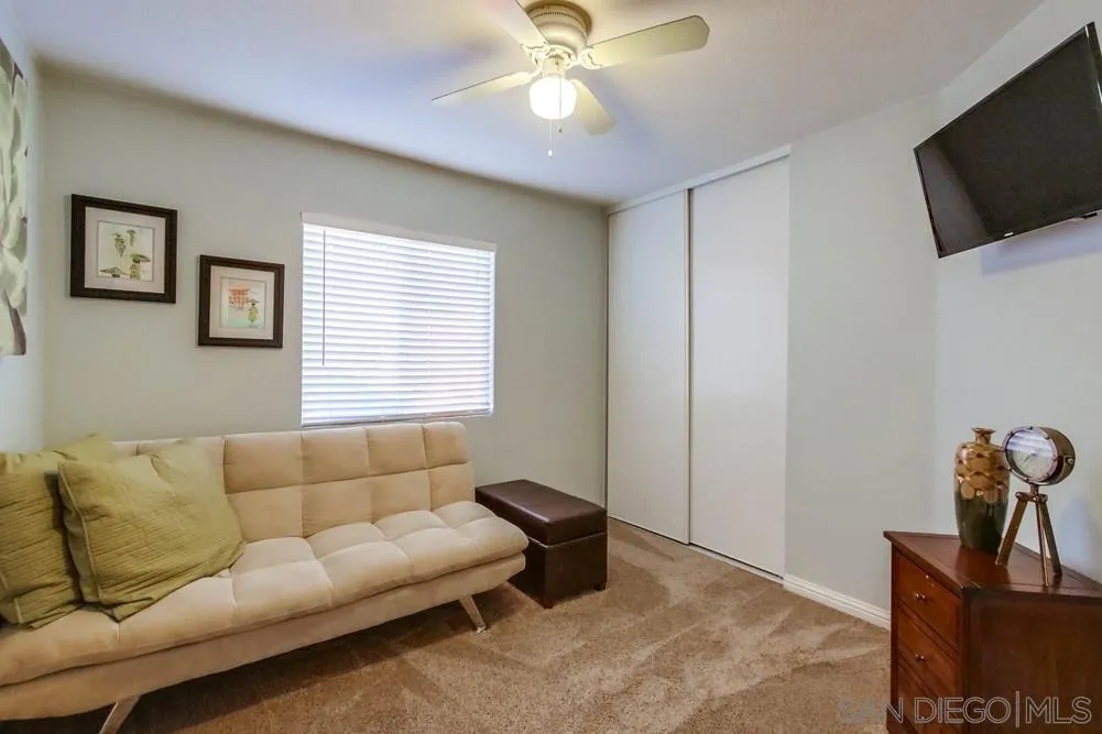 3396 Monique Lane Spring Valley, CA 91977 - Photo 33 of 51 a living room with furniture and a flat screen tv