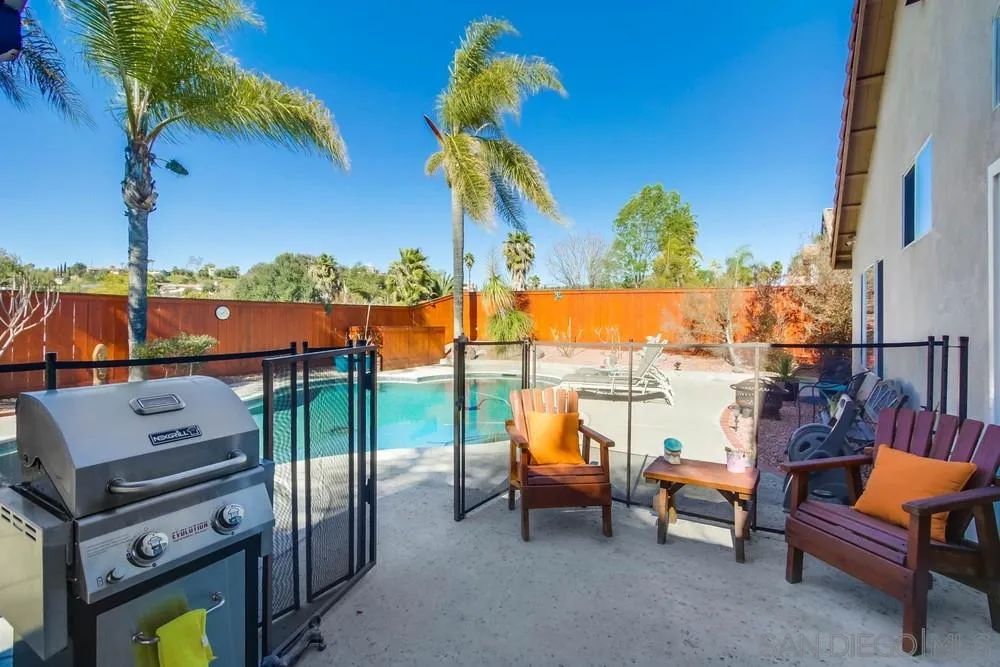 3396 Monique Lane Spring Valley, CA 91977 - Photo 45 of 51 a view of a terrace with furniture and a floor to ceiling window