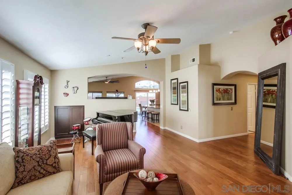3396 Monique Lane Spring Valley, CA 91977 - Photo 5 of 51 a living room with furniture a fireplace and a flat screen tv
