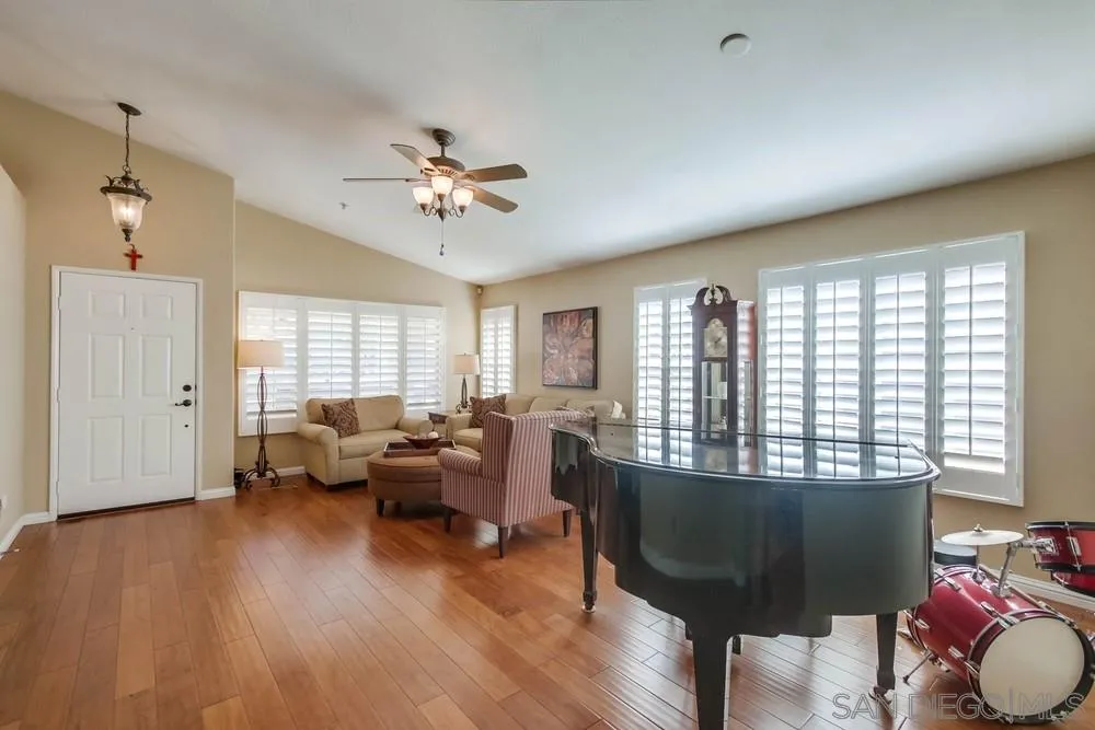 3396 Monique Lane Spring Valley, CA 91977 - Photo 6 of 51 a living room with furniture and a large window