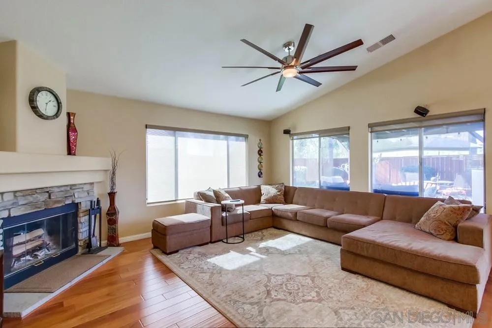 3396 Monique Lane Spring Valley, CA 91977 - Photo 8 of 51 a living room with furniture and a fireplace