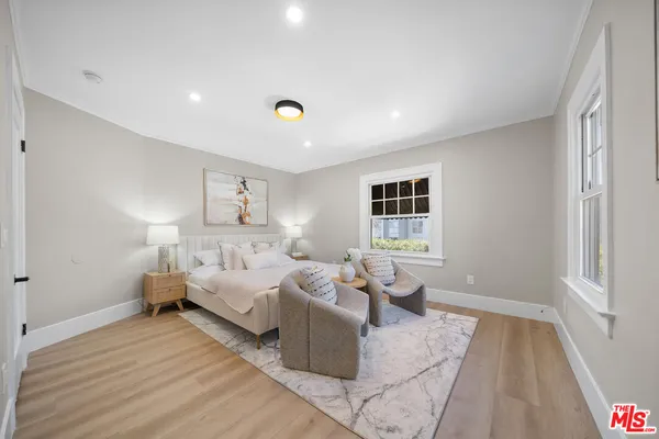 a bed room with bed and window