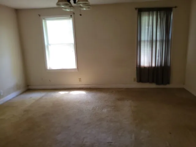 an empty room that has a window