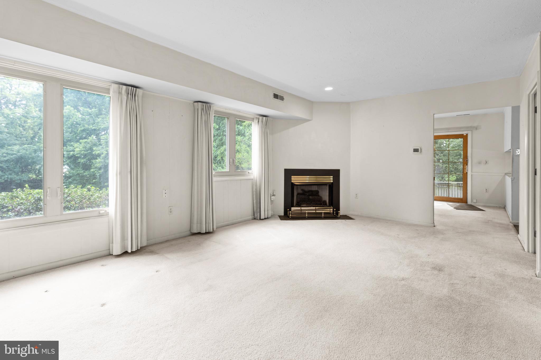 13 Beechtree Lane Mountville, PA 17554 - Photo 5 of 41 an empty room with windows and fireplace