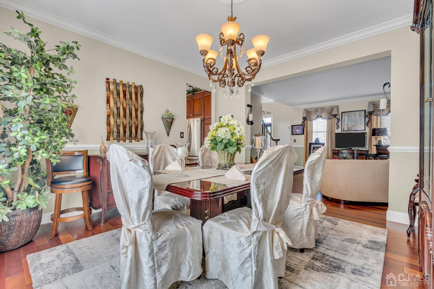 58 Stratton Road Old Bridge, NJ 07747 - Photo 19 of 44 a view of a dining room with furniture and chandelier
