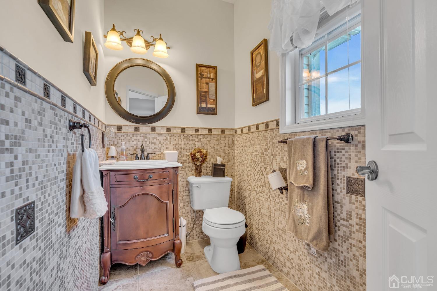 58 Stratton Road Old Bridge, NJ 07747 - Photo 23 of 44 a bathroom with a toilet a sink and a mirror