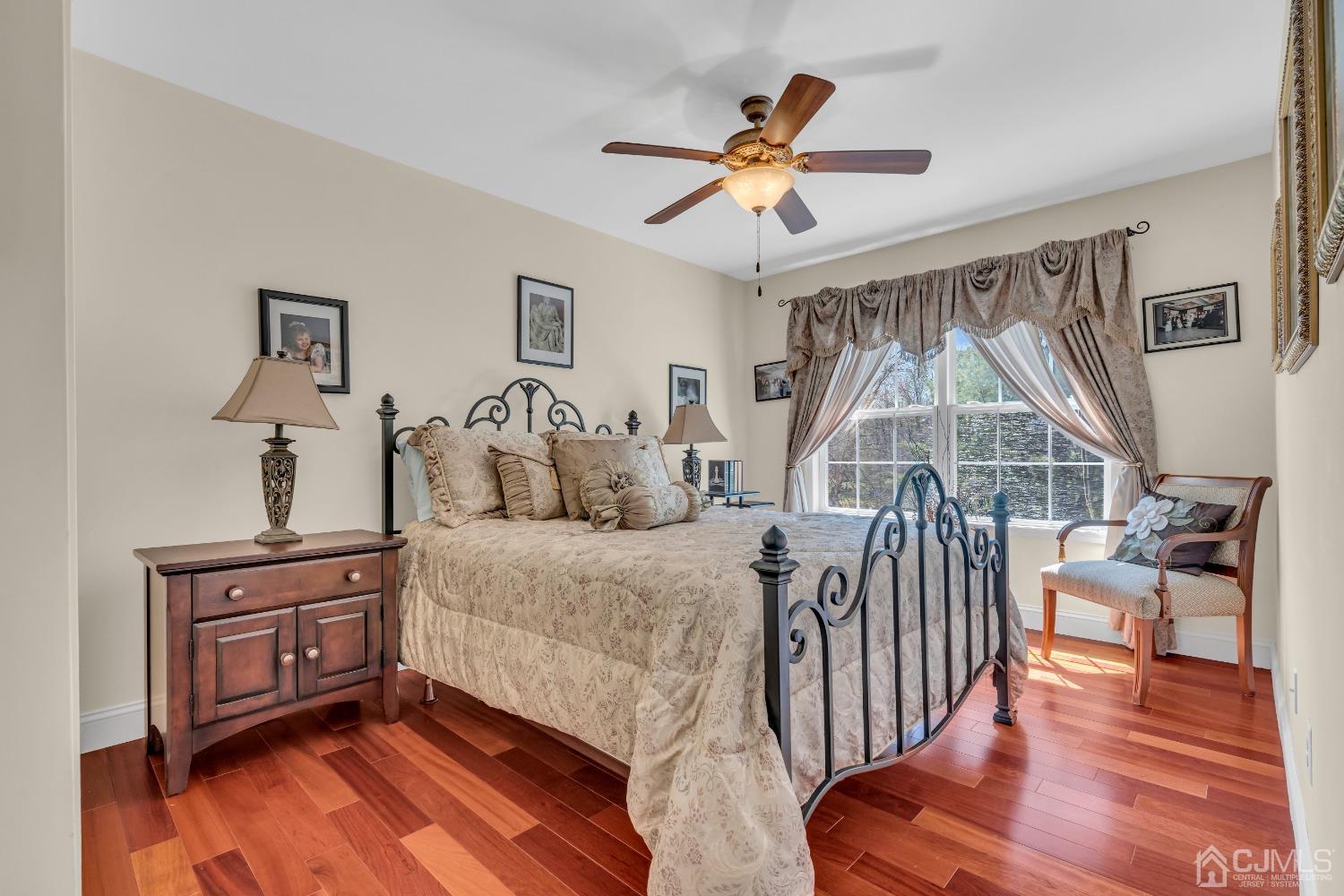 58 Stratton Road Old Bridge, NJ 07747 - Photo 29 of 44 a bedroom with a bed and wooden floor