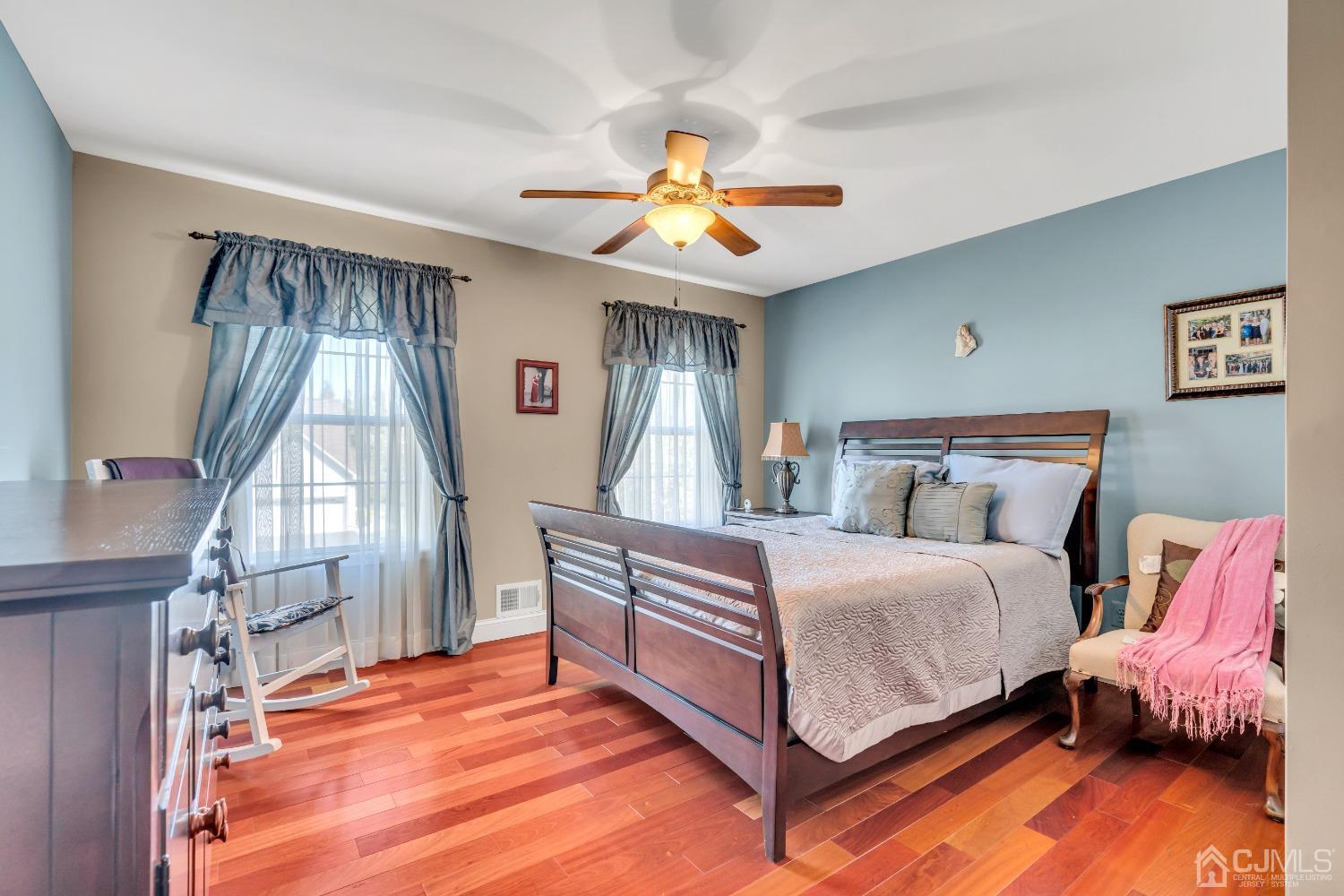 58 Stratton Road Old Bridge, NJ 07747 - Photo 30 of 44 a bedroom with a bed and a chandelier