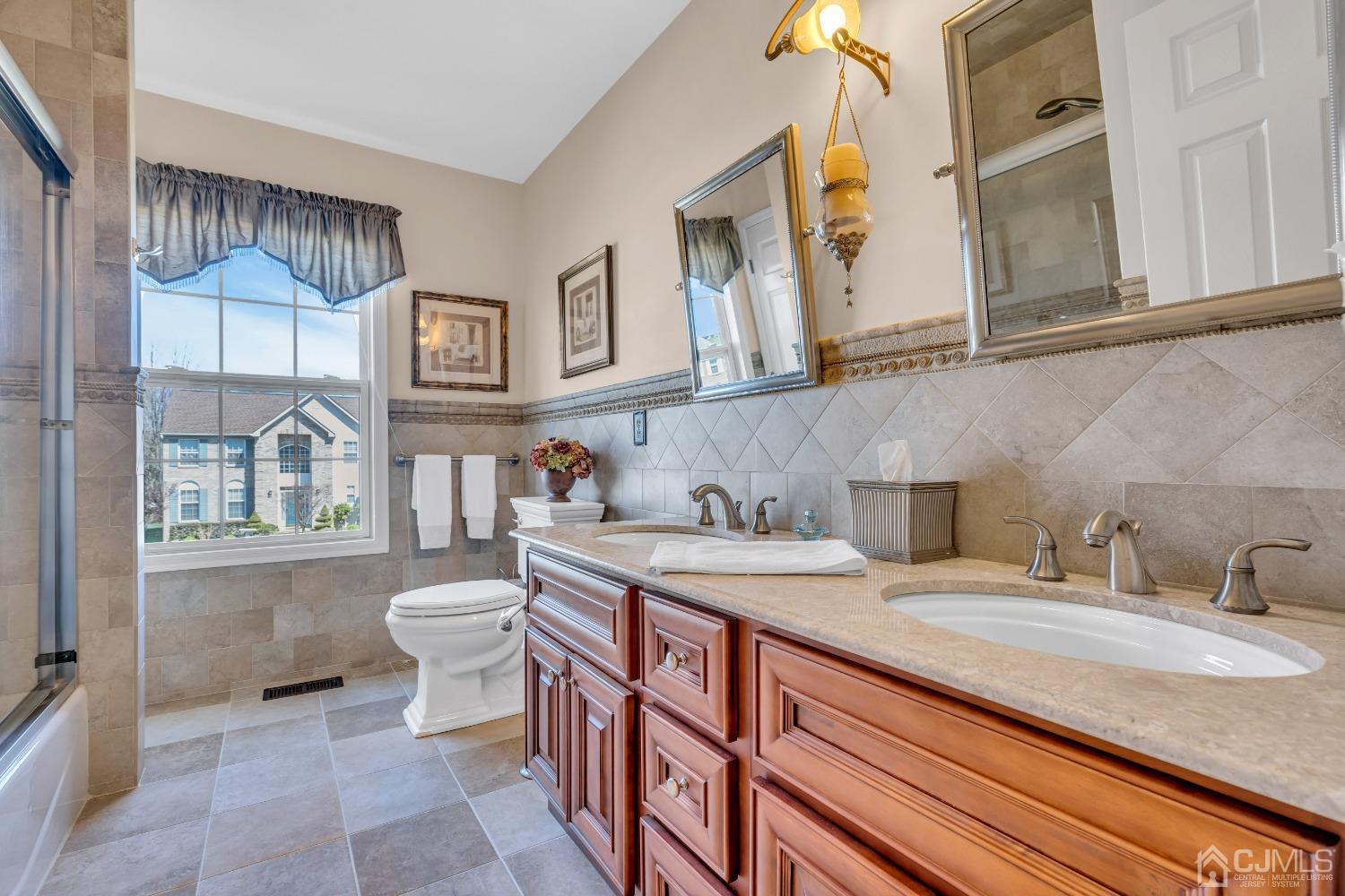 58 Stratton Road Old Bridge, NJ 07747 - Photo 32 of 44 a bathroom with a granite countertop sink and a toilet