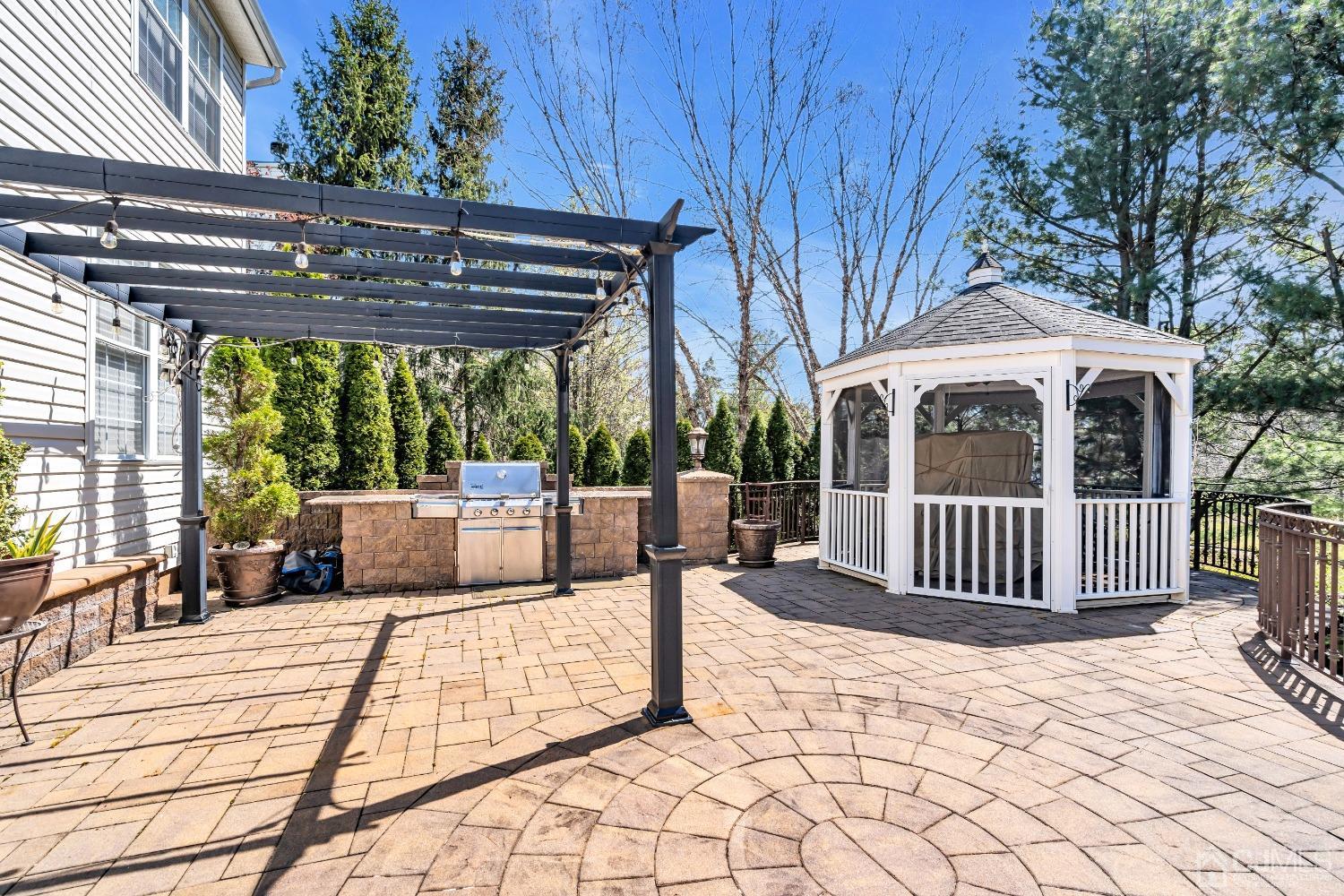 58 Stratton Road Old Bridge, NJ 07747 - Photo 38 of 44 a view of a patio with a table chairs and a yard
