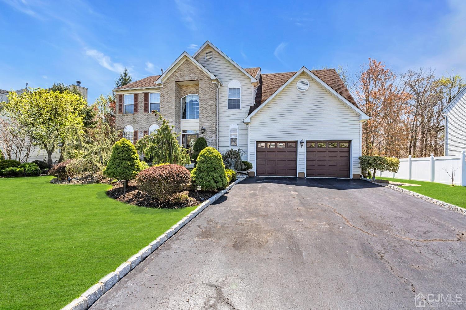 58 Stratton Road Old Bridge, NJ 07747 - Photo 4 of 44 a front view of a house with a yard and garage