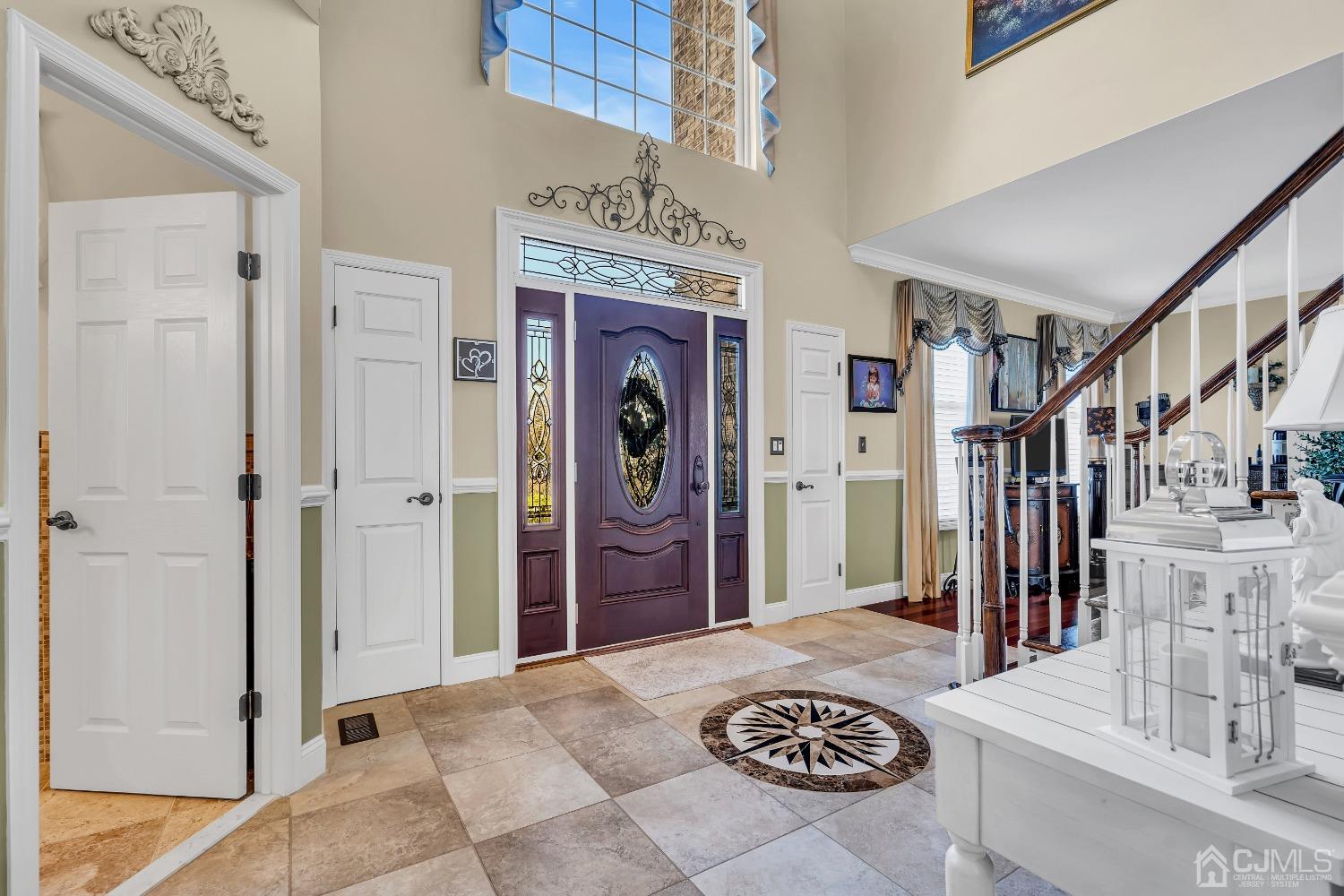 58 Stratton Road Old Bridge, NJ 07747 - Photo 6 of 44 a view of a hallway with a dining table and chairs