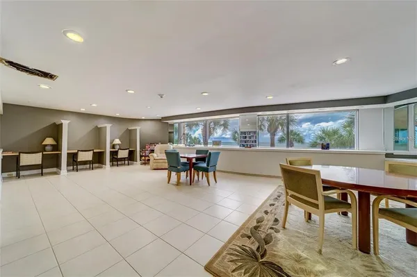a view of a dining room with furniture and a livingroom