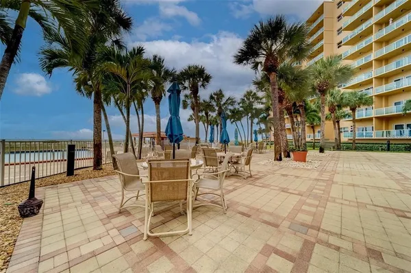a view of a chairs and tables in patio