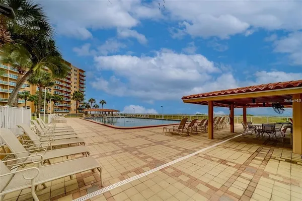 a view of a patio with swimming pool