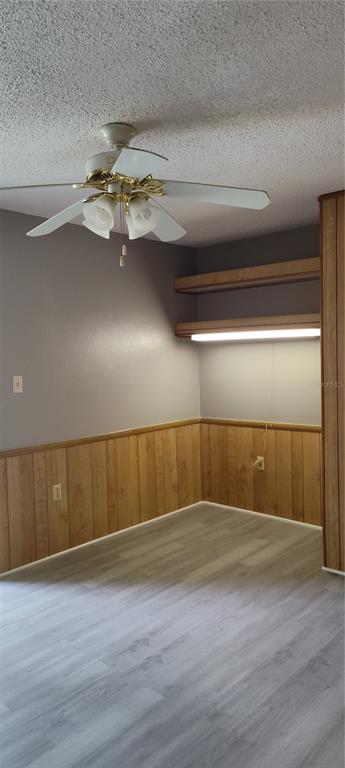 2811 Southwest Archer Road, Unit F46 Gainesville, FL 32608 - Photo 5 of 17 a view of an empty room with wooden floor