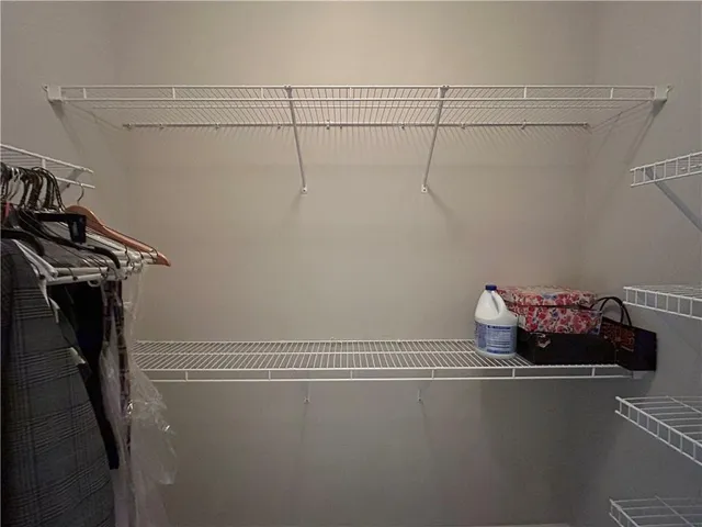 a picture of a room with racks on the wall