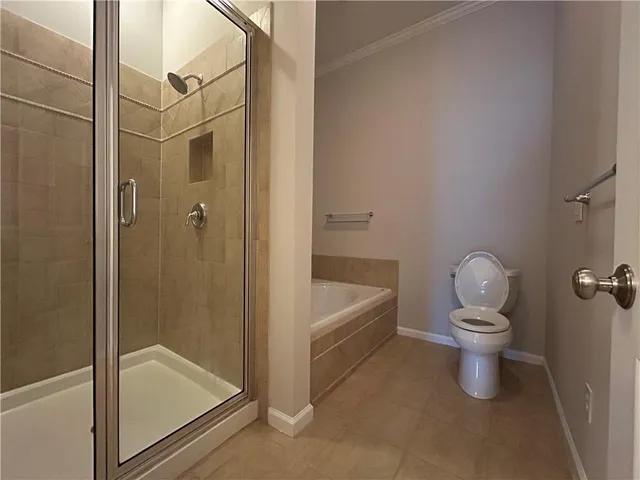 a bathroom with a granite countertop toilet a sink and bathtub