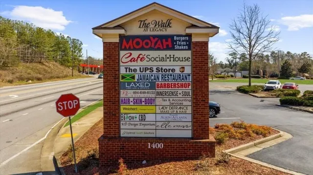 an aerial view of residential house with outdoor space and swimming pool