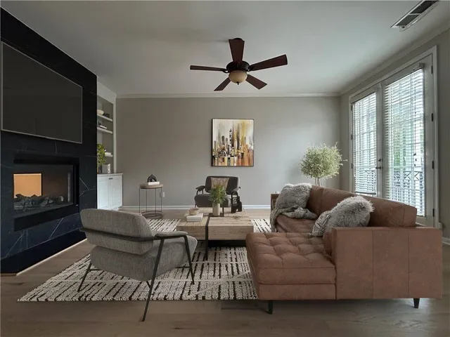 a living room with furniture and a fireplace