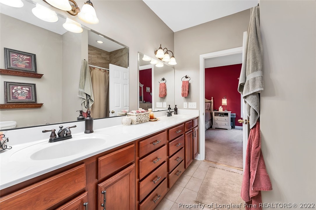 145 Covenant Road Carthage, NC 28327 - Photo 19 of 42 a bathroom with a sink double vanity and a mirror