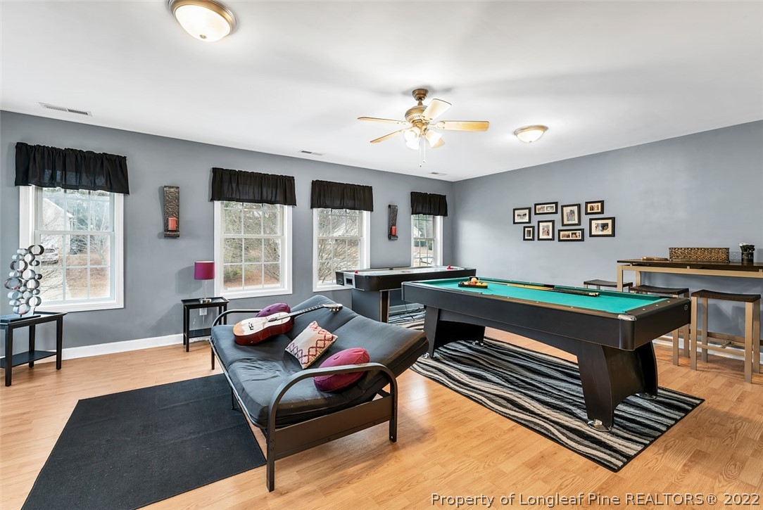 145 Covenant Road Carthage, NC 28327 - Photo 29 of 42 a living room with furniture and a chandelier