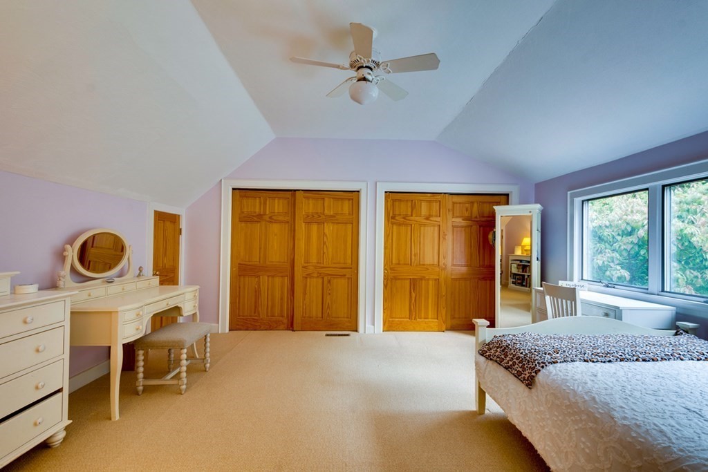 29 Sheridan Road Wellesley, MA 02481 - Photo 15 of 32 a spacious bedroom with a bed and a table