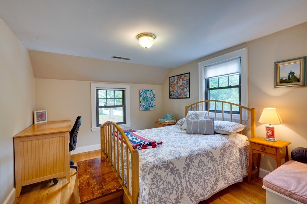 29 Sheridan Road Wellesley, MA 02481 - Photo 19 of 32 a bedroom with a bed and wooden floor