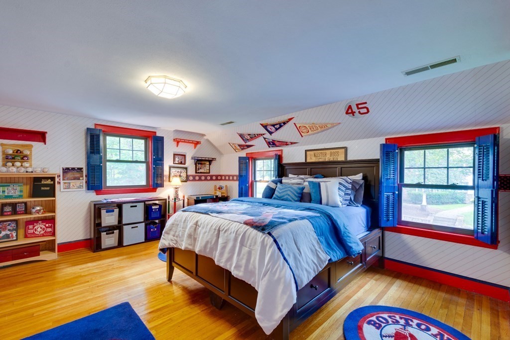29 Sheridan Road Wellesley, MA 02481 - Photo 20 of 32 a bedroom with a bed and dresser with wooden floor