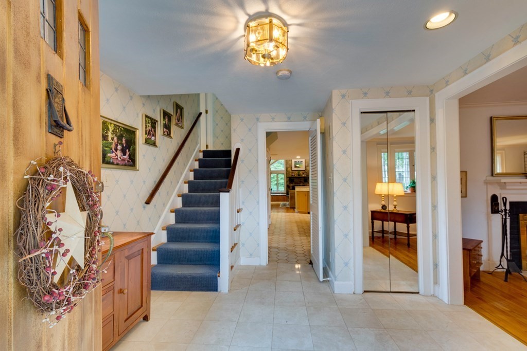 29 Sheridan Road Wellesley, MA 02481 - Photo 2 of 32 a view of an entryway with wooden floor and a livingroom