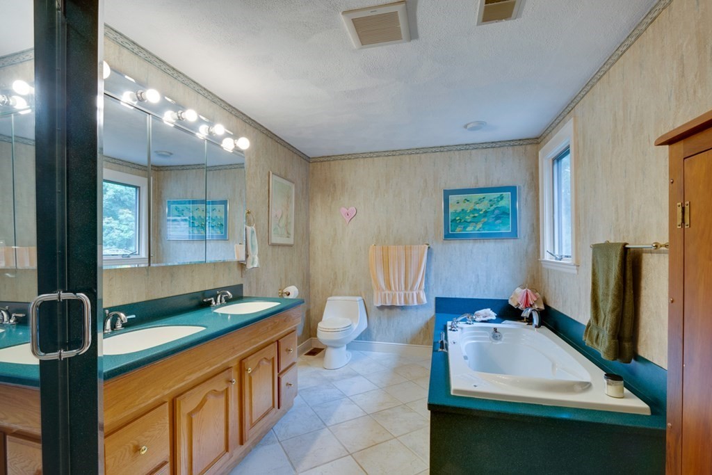 29 Sheridan Road Wellesley, MA 02481 - Photo 23 of 32 a kitchen with kitchen island a sink stove and refrigerator