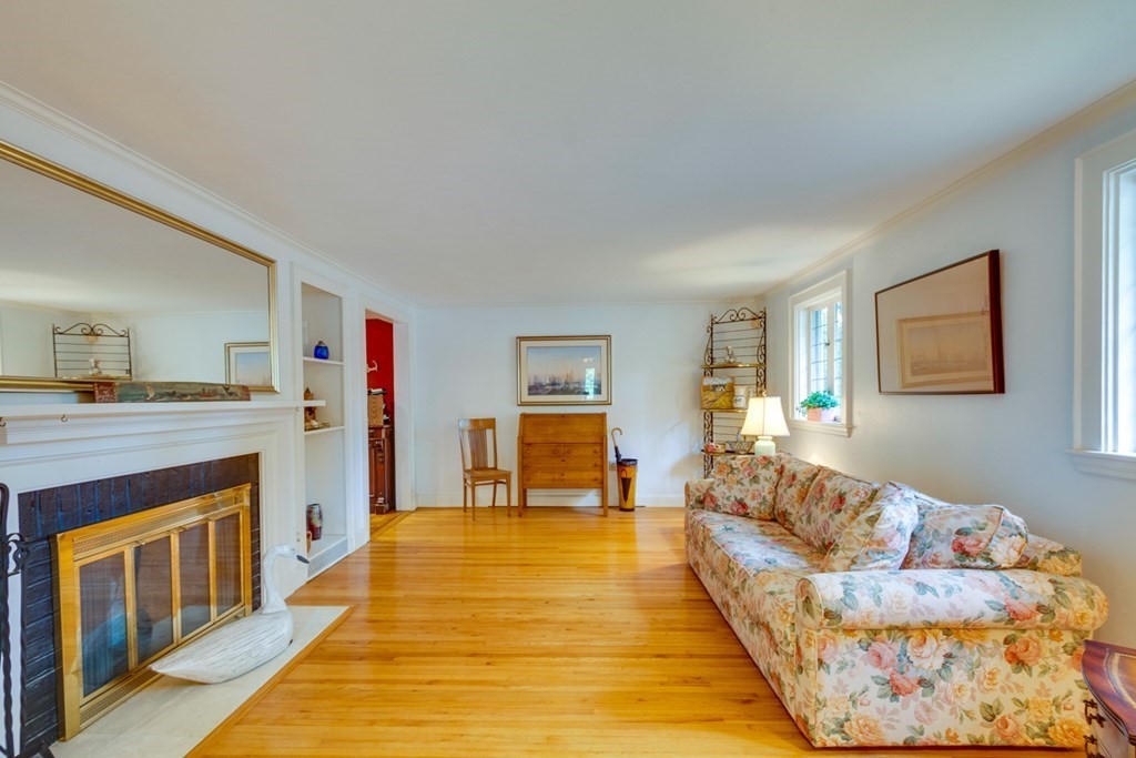 29 Sheridan Road Wellesley, MA 02481 - Photo 3 of 32 a living room with furniture and a fireplace