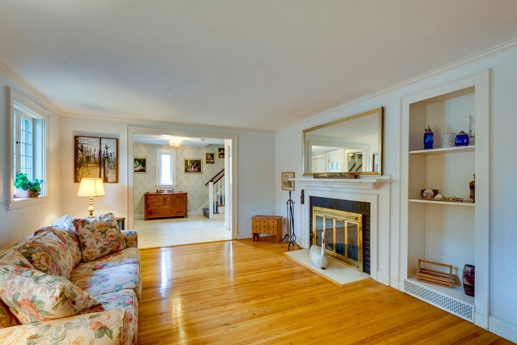 29 Sheridan Road Wellesley, MA 02481 - Photo 4 of 32 a living room with furniture and a fireplace