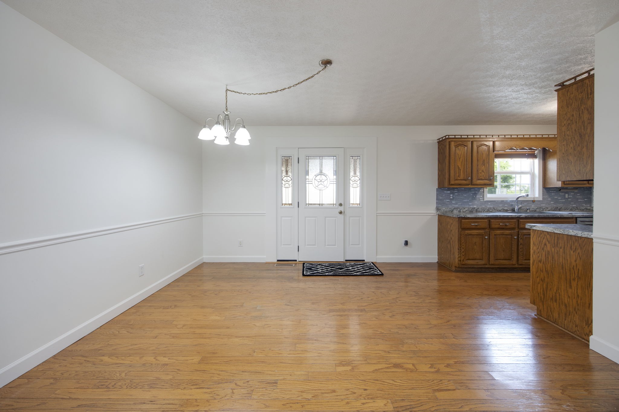 880 Denning Ford Road Portland, TN 37148 - Photo 13 of 54 a view of a kitchen with a sink cabinets and wooden floor