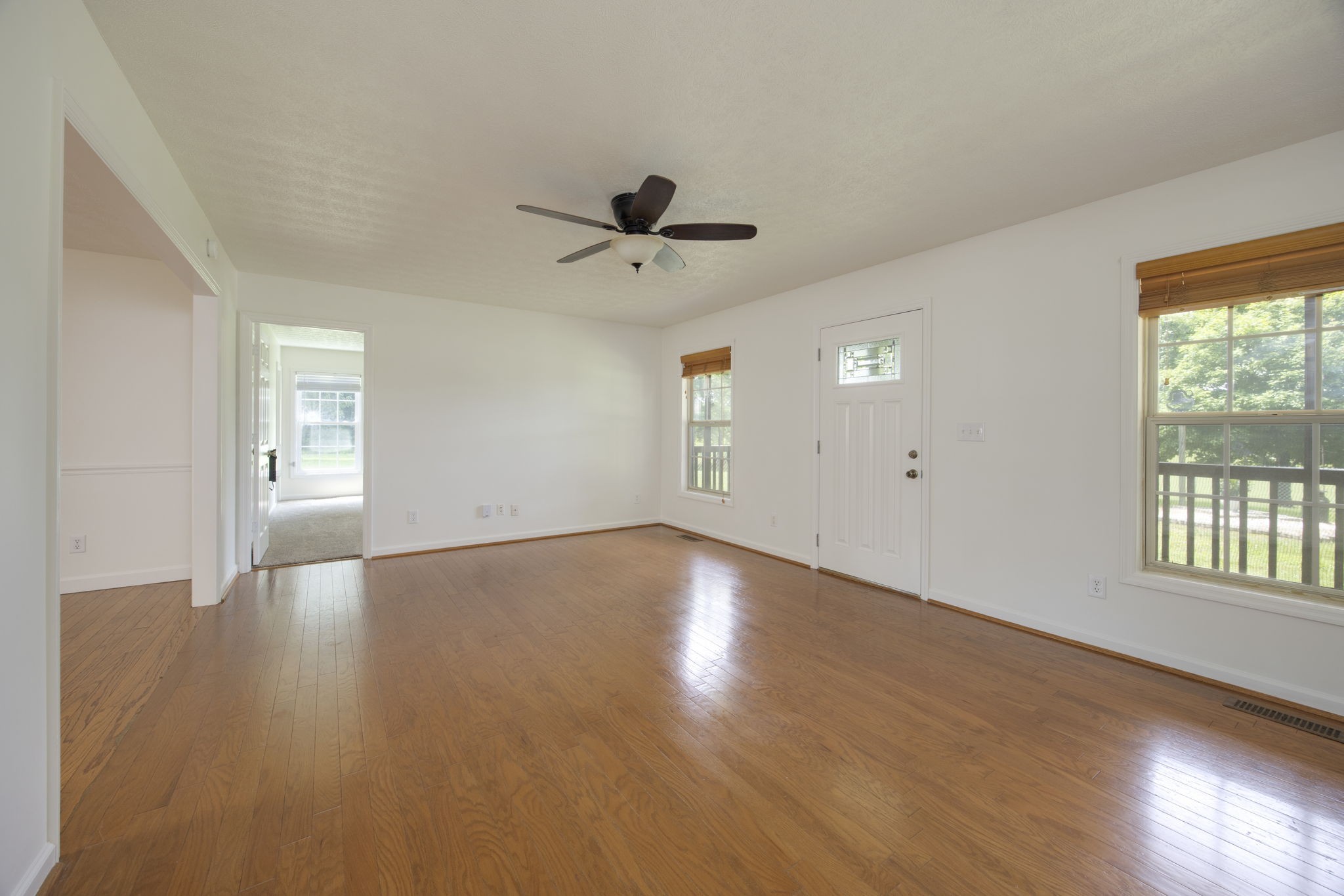 880 Denning Ford Road Portland, TN 37148 - Photo 2 of 54 a view of an empty room with a window and wooden floor