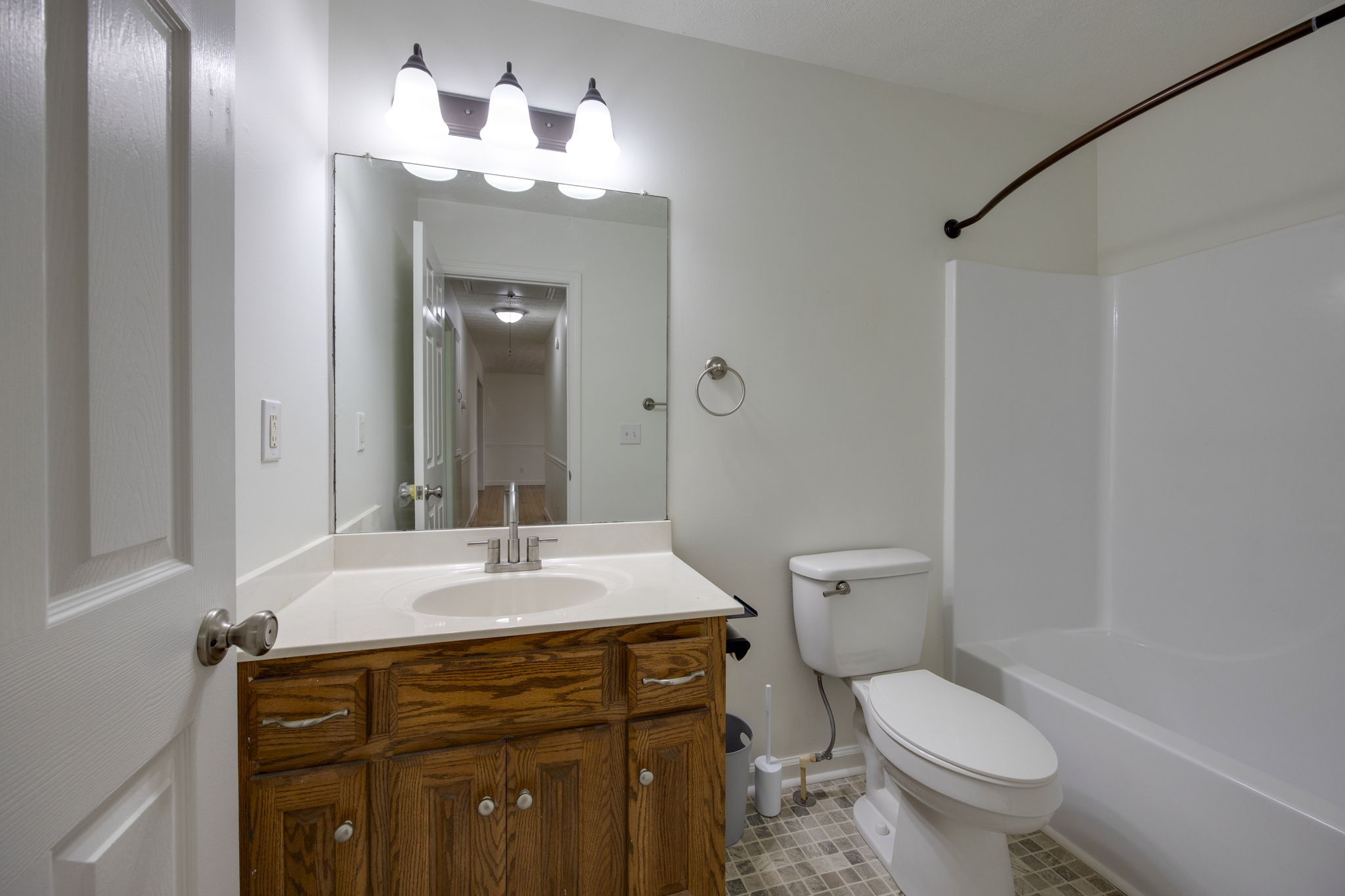 880 Denning Ford Road Portland, TN 37148 - Photo 28 of 54 a bathroom with a sink vanity mirror and toilet