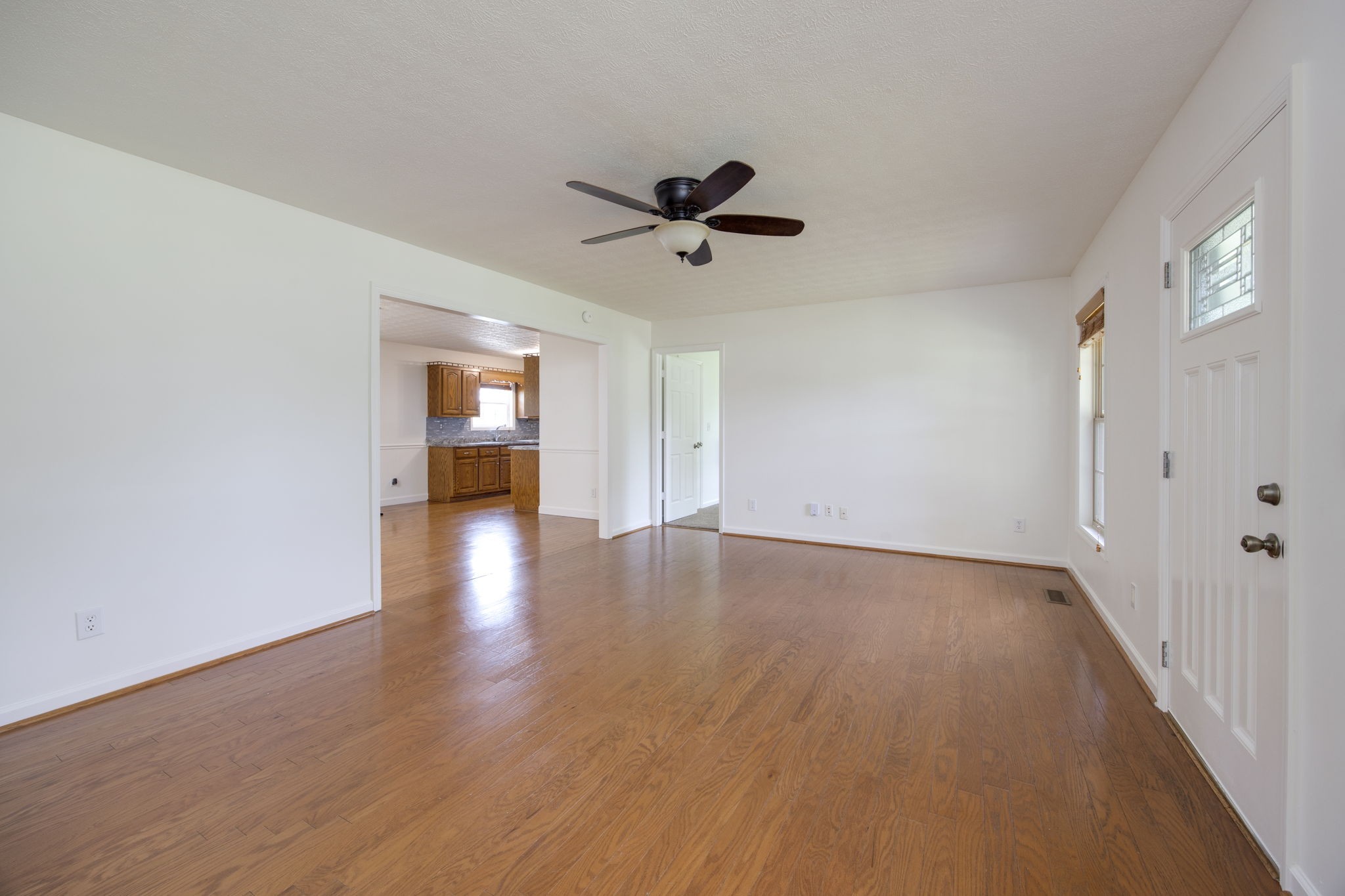 880 Denning Ford Road Portland, TN 37148 - Photo 3 of 54 wooden floor in an empty room with a window