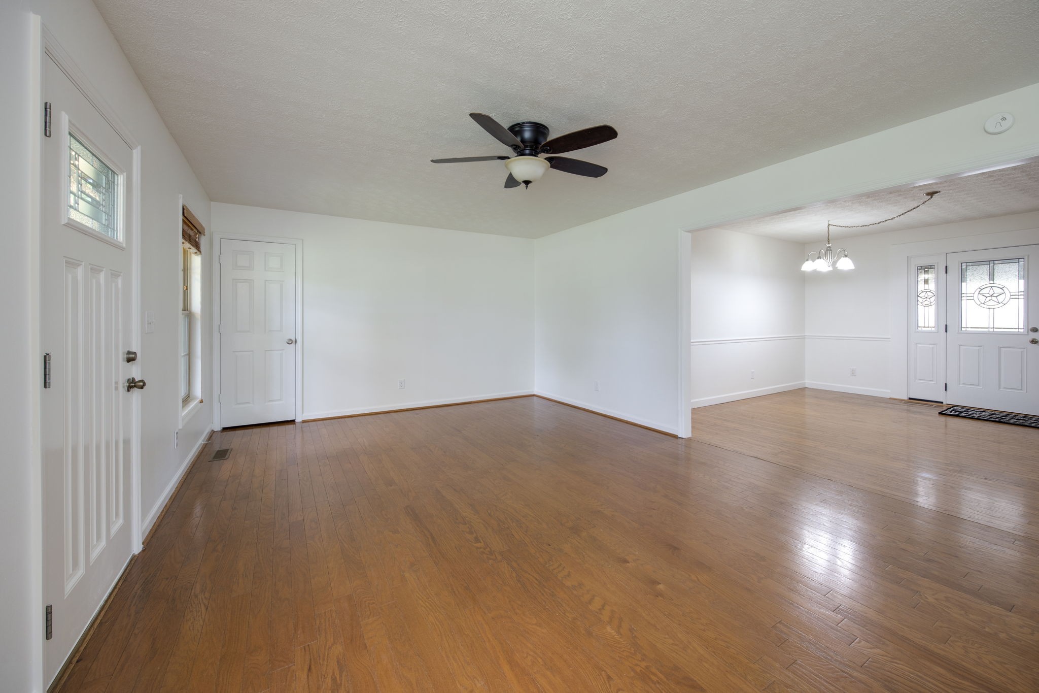 880 Denning Ford Road Portland, TN 37148 - Photo 4 of 54 wooden floor in an empty room with a window