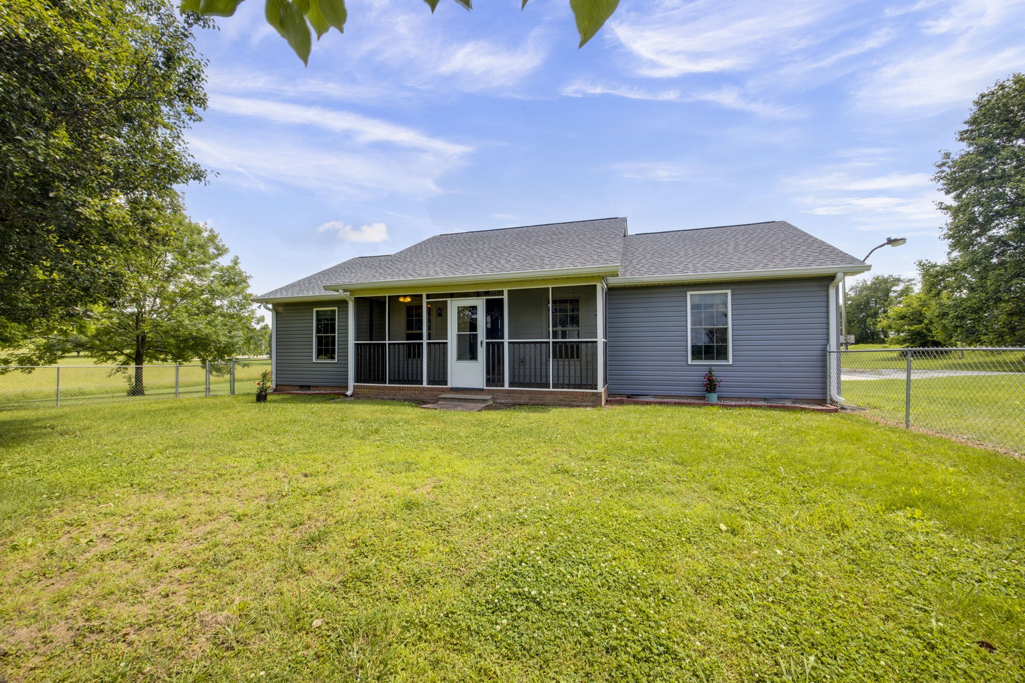 880 Denning Ford Road Portland, TN 37148 - Photo 7 of 54 a front view of a house with a garden