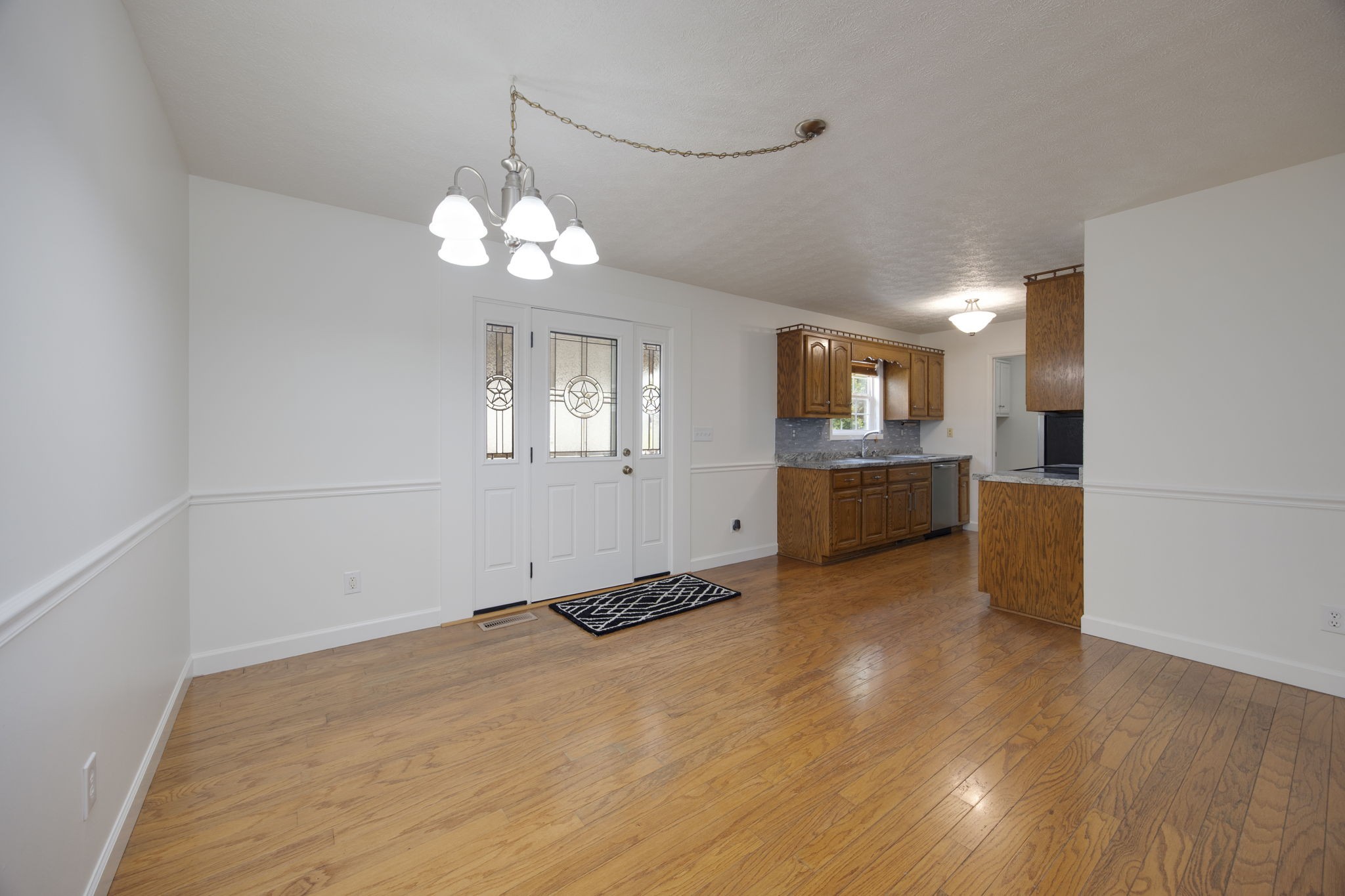 880 Denning Ford Road Portland, TN 37148 - Photo 9 of 54 a view of a kitchen with stove cabinets and wooden floor
